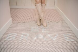 Pink tiles spell out Be Brave to highlight trying your best even when you are overwhelmed.